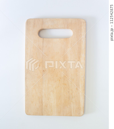 Wooden cutting board in top view, closed up shot on white background. 112542875