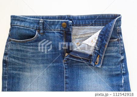 Blue jean skirt in front view on white background, closed-up studio shot. 112542918