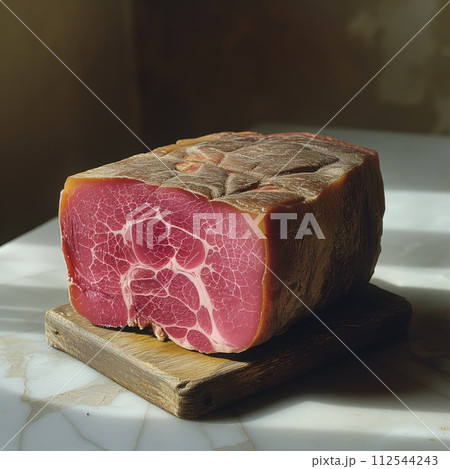 piece of jamon on kitchen board 112544243