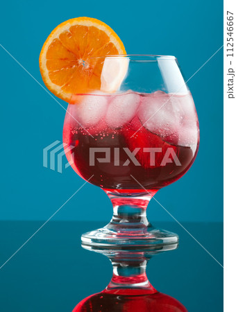 red coctail drink with ice cubs red coctail drink with ice cubs 112546667