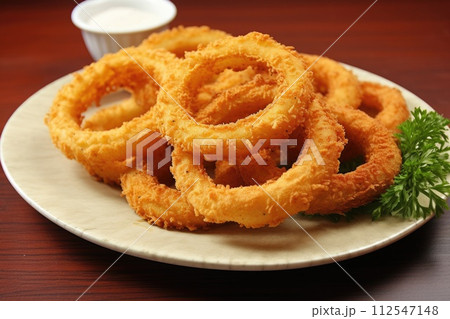 A platter of crispy onion rings. Generative AI 112547148