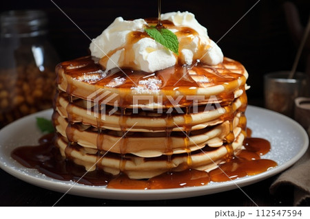 Pancakes with maple syrup, waffles with whipped cream. Generative AI 112547594
