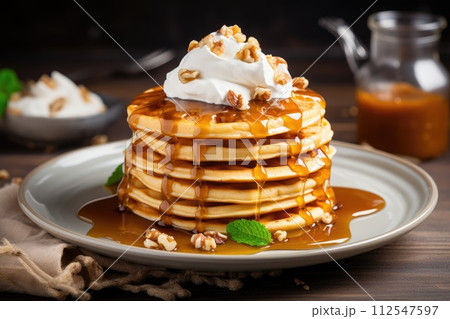 Pancakes with maple syrup, waffles with whipped cream. Generative AI 112547597
