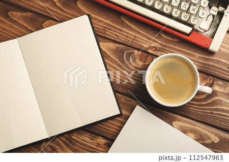 Vintage typewriter on wooden table close up Vintage typewriter on wooden table close up 112547963