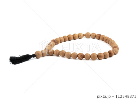 Wooden simple prayer rosary isolated on a white background. 112548873