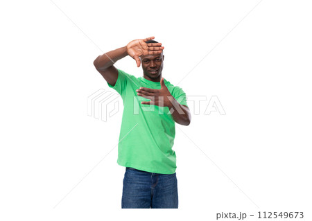 young charismatic american man in green t-shirt and jeans isolated on white background with copy young charismatic american man in green t-shirt and jeans isolated on white background with copy 112549673