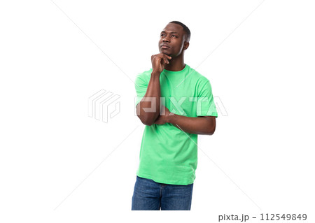 young smart american guy promoter dressed in a mint t-shirt on a white background 112549849