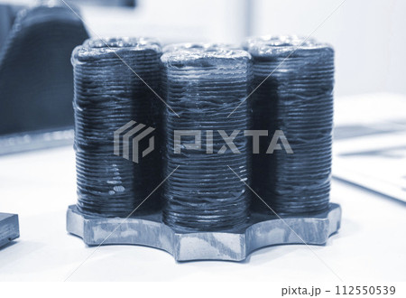 3d printed metal model close-up. Model printed on a 3D printer made of metal. Three-dimensional metal object created by a 3d printer from metal. 3D printing additive modeling manufacturing technology 112550539