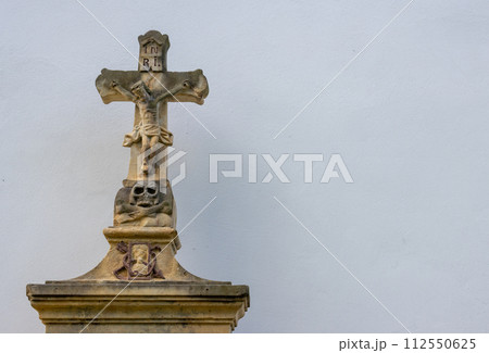 Historical cross of a tomb, church in Dlouhomilov, Czechia Historical cross of a tomb, church in Dlouhomilov, Czechia 112550625
