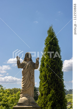 Statue of Jesus on a grave, Dlouhomilov, Czechia 112550668