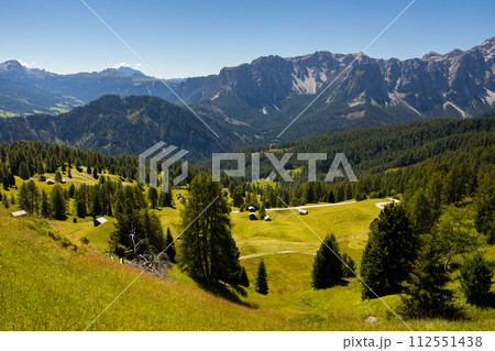 Wooden farm building on hillside in area pass Goma Dolomites Wooden farm building on hillside in area pass Goma Dolomites 112551438