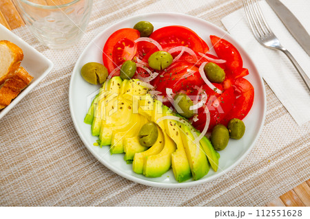 Fresh tomato, olive, avocado, onion, salad 112551628