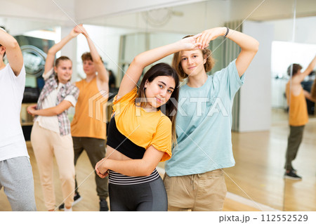 Teenagers dancing salsa in studio 112552529