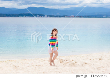 Kids playing on beach. Children play at sea. Kids playing on beach. Children play at sea. 112559439