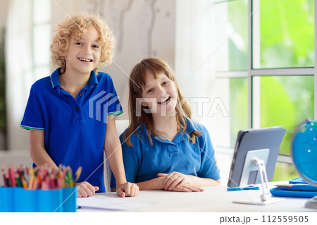 Online remote learning. School kids with computer. 112559505