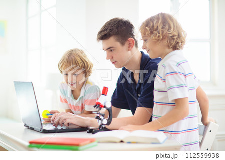 School kids with microscope. Science class. School kids with microscope. Science class. 112559938