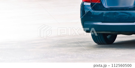 Trunk of blue car parked on a cement road. banner with copy space Trunk of blue car parked on a cement road. banner with copy space 112560500