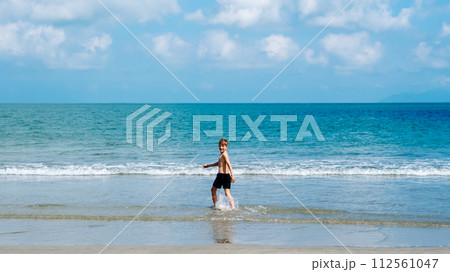 Boy back Blue calm Sea sun Sky background, universe possibilities are limitless, step moving forward Boy back Blue calm Sea sun Sky background, universe possibilities are limitless, step moving forward 112561047