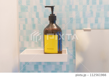 Toiletries bottles in bathroom at luxury hotel or modern home. Hair Shampoo container with marble wall background 112561966