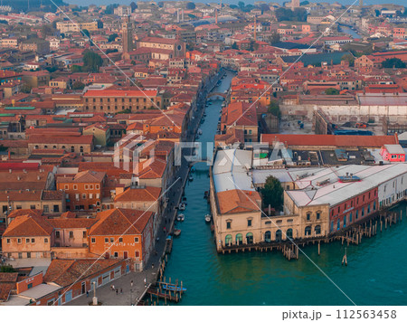 Aerial view of Murano island in Venetian lagoon sea from above, Italy at sunset Aerial view of Murano island in Venetian lagoon sea from above, Italy at sunset 112563458