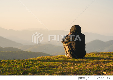 nature traveling with solo man play with dog and see sunrise with layer of mountain nature traveling with solo man play with dog and see sunrise with layer of mountain 112565235