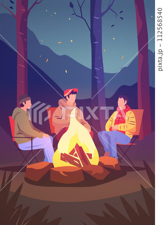 hikers sitting near campfire hiking camping concept people spend time at night summer camp in forest friends company on vacation 112568540