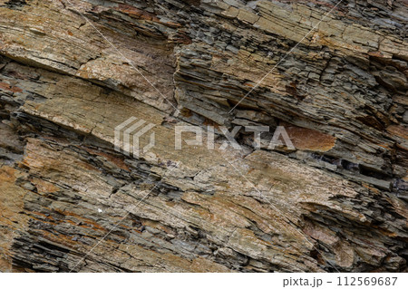 Rough rocky mountain texture. Sedimentary rock texture 112569687