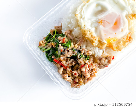 Rice topped with pork with Thai basil and fried egg Rice topped with pork with Thai basil and fried egg 112569754