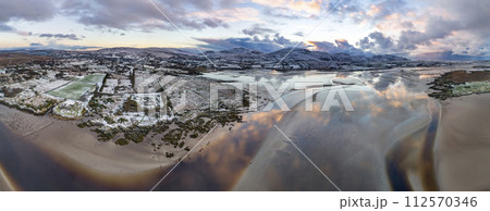 Aerial view of a snow covered Ardara GAA in County Donegal - Ireland 112570346