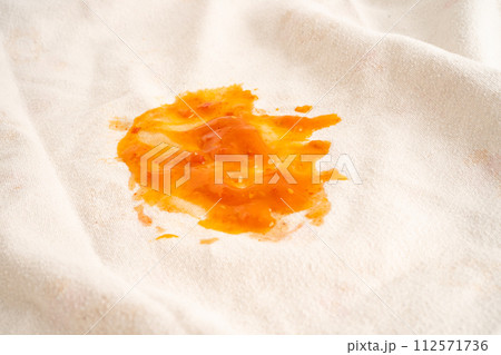 Dirty tomato sauce stain or ketchup on cloth to wash with washing powder, cleaning housework. Dirty tomato sauce stain or ketchup on cloth to wash with washing powder, cleaning housework. 112571736