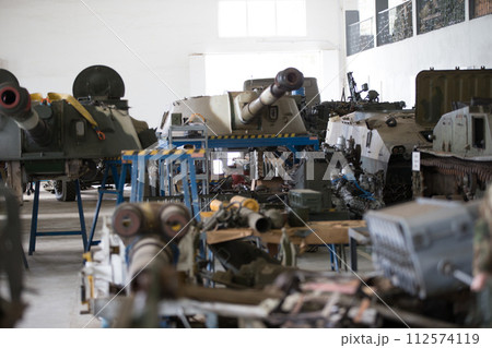 Military factory.Warehouse of military equipment. Battle tanks in the factory 112574119