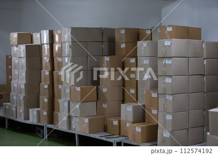 Warehouse with cardboard boxes Warehouse with cardboard boxes 112574192