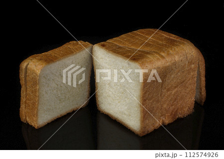 White bread for toast on a black background White bread for toast on a black background 112574926