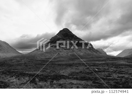 Striking black and white Buachaille Etive Mor, standing majestic in the vast Scottish Highlands 112574941