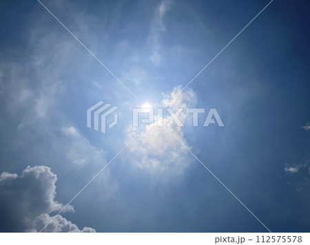 Heavenly white clouds on the blue sky with the sun appeared Heavenly white clouds on the blue sky with the sun appeared 112575578
