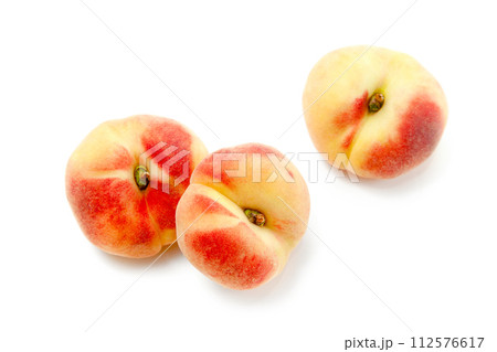 Three saturn peaches or flat peaches isolated on white background with clipping path.. Three saturn peaches or flat peaches isolated on white background with clipping path.. 112576617