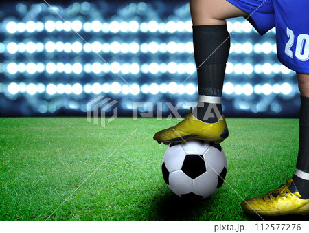 man on soccer field and the bright lights 112577276