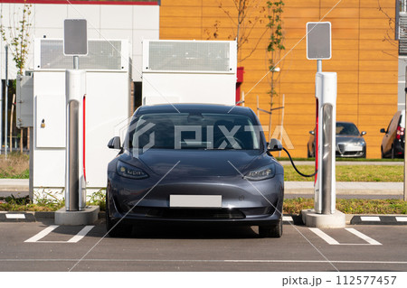 Electric car with a charging station. 112577457