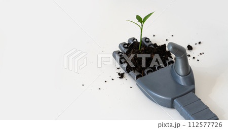 Robot arm with a plant. Digital transformation in agriculture and smart farming.. 112577726