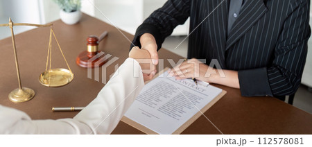 Businesswoman handshake to seal a deal judge female lawyers consultation legal services Consulting in regard to the various contract  112578081