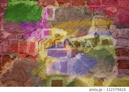 Brick wall with multi-colored paint close-up. Background brick creative. 112579828