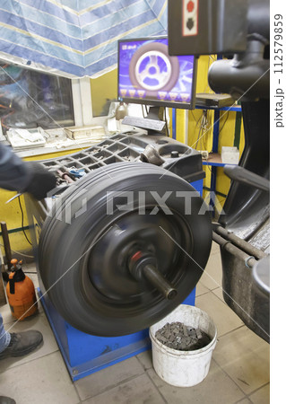 Car wheel repair in a tire workshop. Car wheel repair in a tire workshop. 112579859