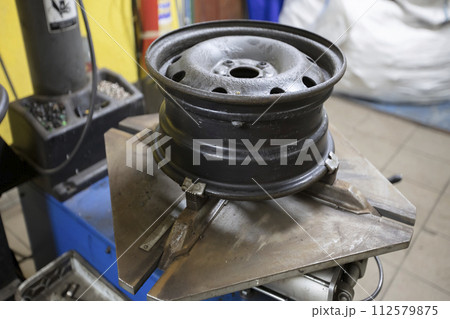 Disassembly of the wheel. Car drive. Tire service. Disassembly of the wheel. Car drive. Tire service. 112579875