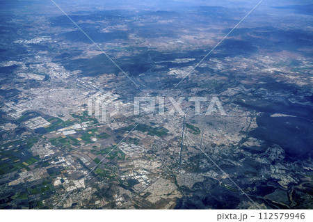 Aerial view of Santiago de Queretaro, a city in central Mexico. Panorama from airplane Aerial view of Santiago de Queretaro, a city in central Mexico. Panorama from airplane 112579946