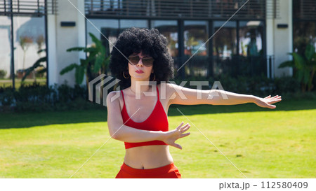 Woman doing sports exercises early in the morning 112580409