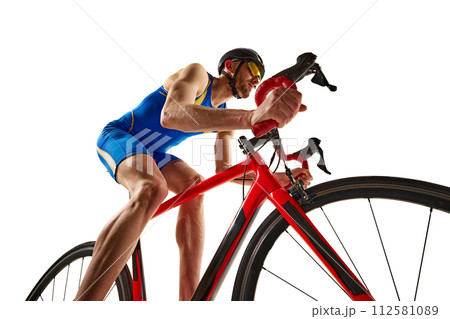 Bottom view dynamic image of man, athlete, cyclist in motion riding on bike isolated on white studio background 112581089