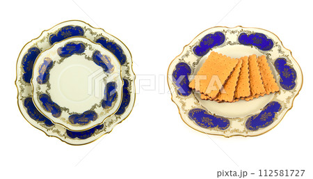Vintage saucers and plates isolated on white. There is free space for text. Collage. Wide photo. Vintage saucers and plates isolated on white. There is free space for text. Collage. Wide photo. 112581727