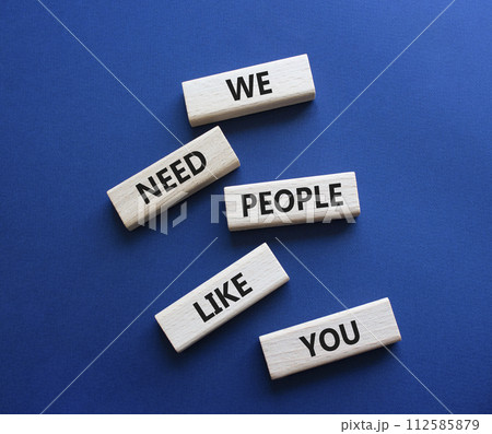 Hiring symbol. Wooden blocks with words We need People like You. Beautiful deep blue background. Business and Hiring concept. Copy space. Hiring symbol. Wooden blocks with words We need People like You. Beautiful deep blue background. Business and Hiring concept. Copy space. 112585879