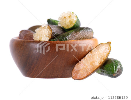 Fresh finger limes in wooden bowl isolated on white background. Caviar lime. Fruits pods. 112586129