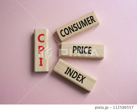 CPI - Consumer Price Index symbol. Concept word CPI on wooden blocks. Beautiful pink background. Business and CPI concept. Copy space. 112586557